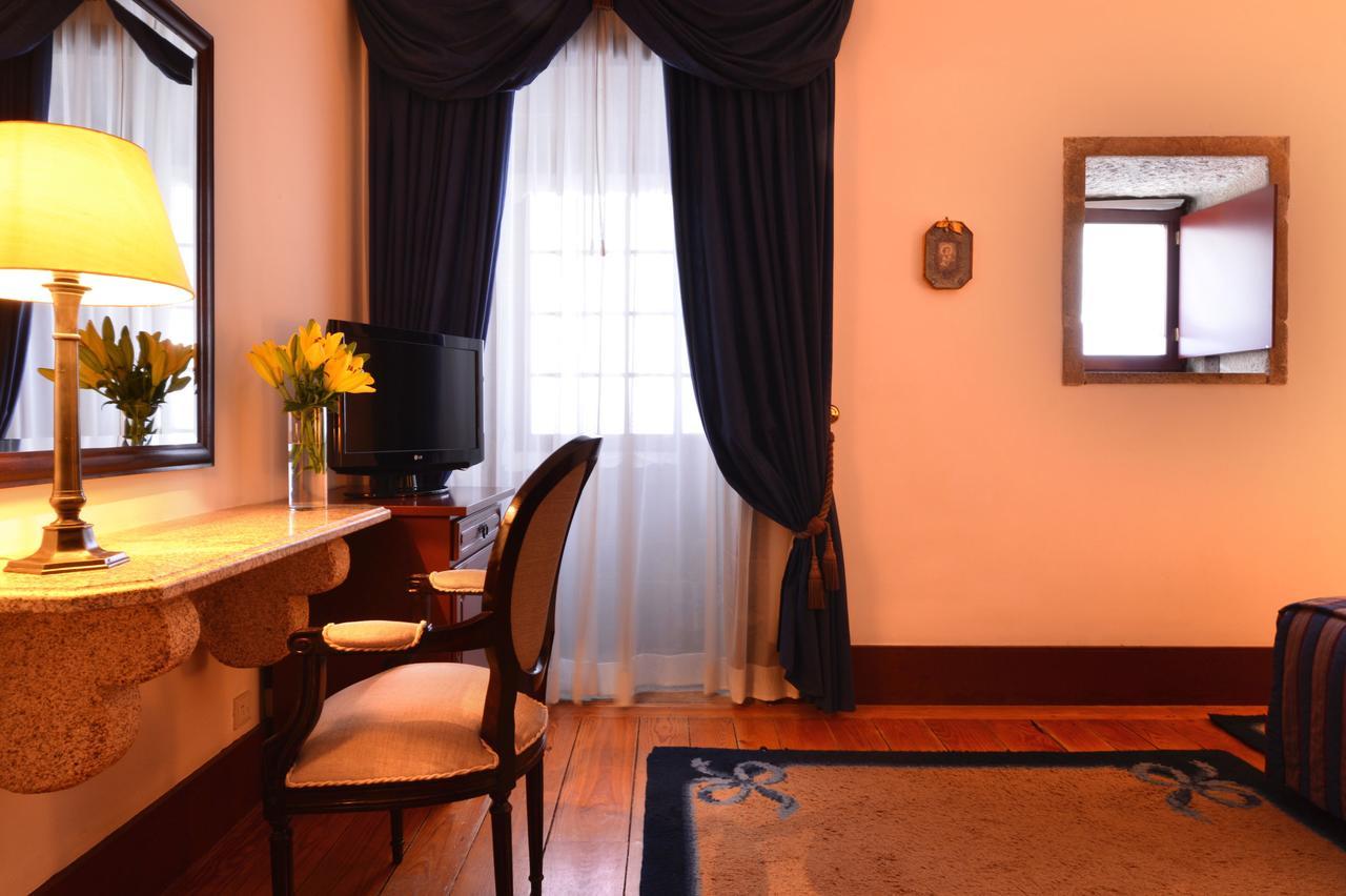 โปอูซาดา มอสเตอิโร เดอ กิมาราเอส- โมนิวเมนต์ โฮเต็ล Hotel กิมาไรส์ ห้อง รูปภาพ A room at the hotel